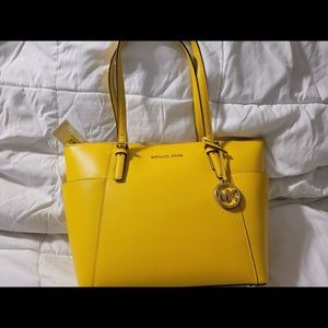 Yellow Michael Kors purse.